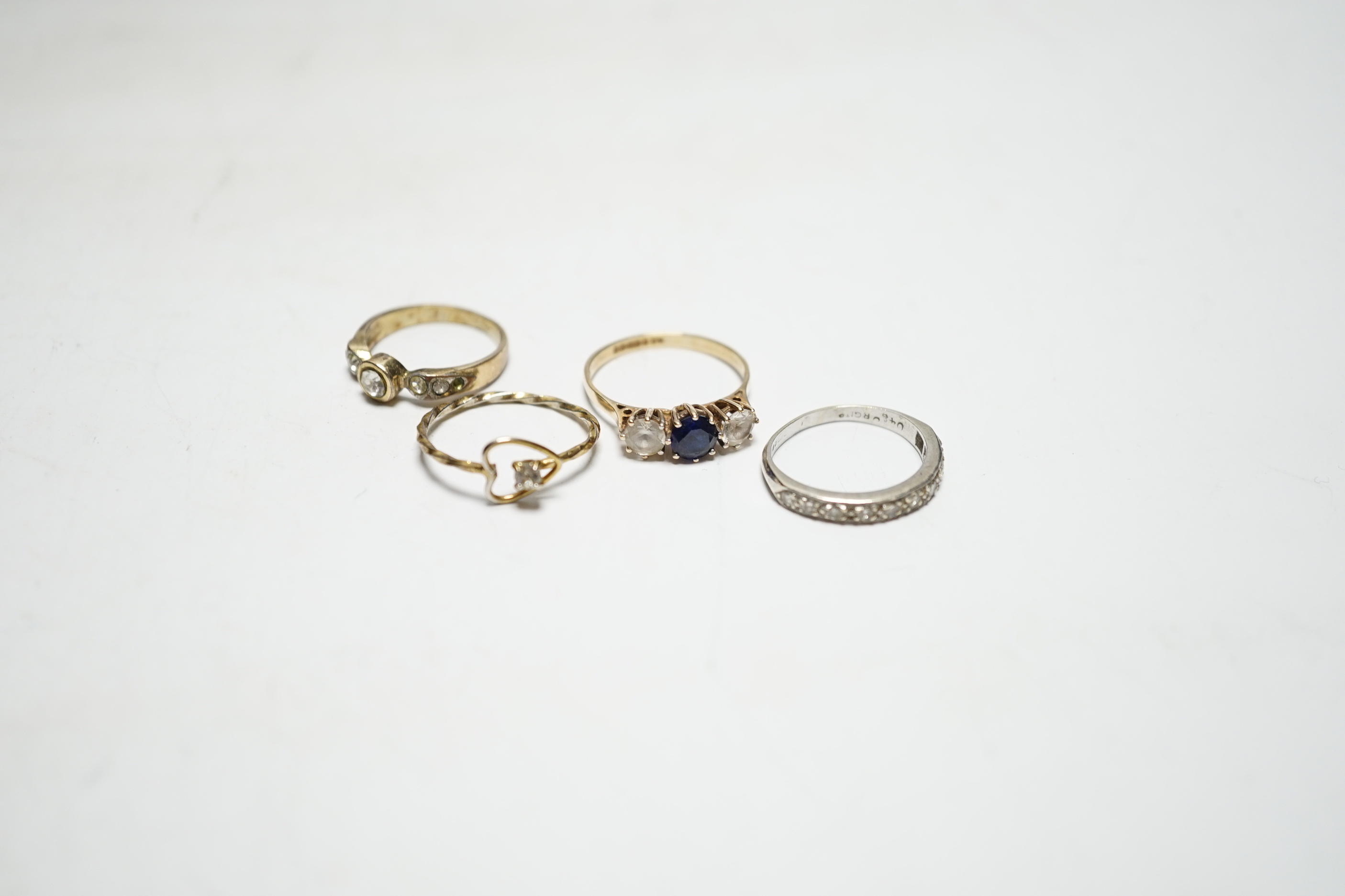 Two 9ct and gem set rings, including diamond chip half eternity and two other rings.